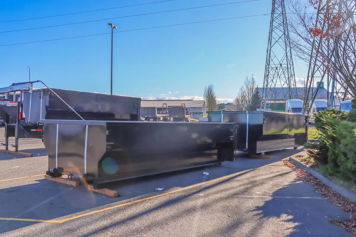 Roll-off dumpster ready for waste disposal at job site for 2 Yard Dumpster Rental in Camden